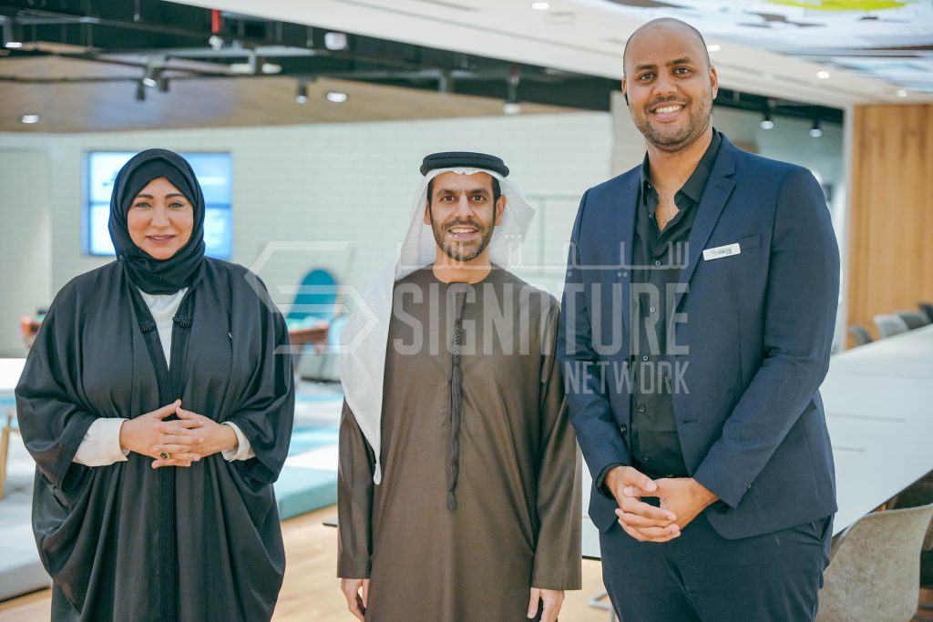 Three people wearing business attire