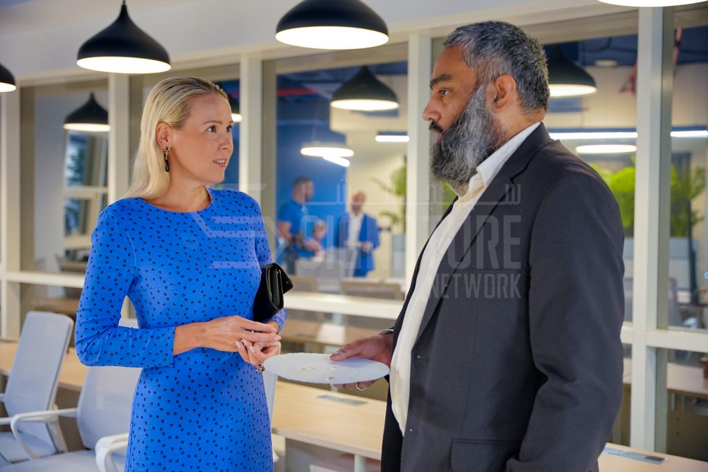 Two professionals engaged in conversation.